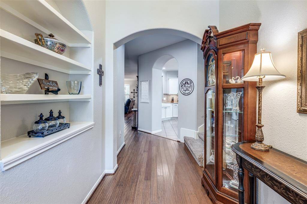 Front foyer entrance with custom shelving for decor.