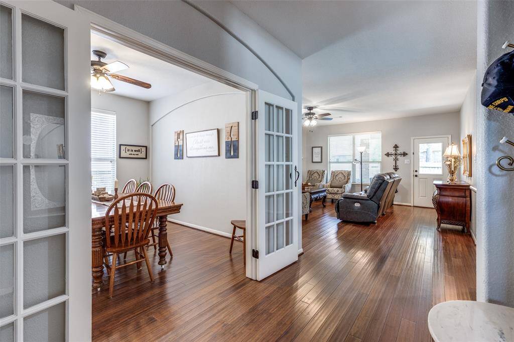 Dining space with french doors is next to the main floor living room.