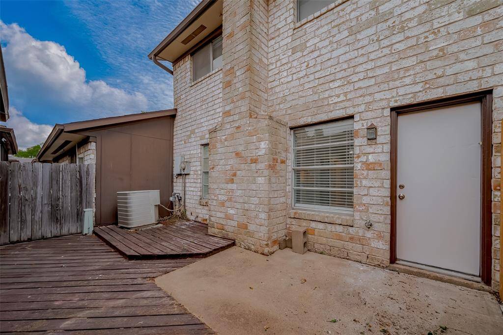 The private, fenced backyard offers a generous patio space—ideal for relaxed mornings, casual entertaining, or simply unwinding in the open air.