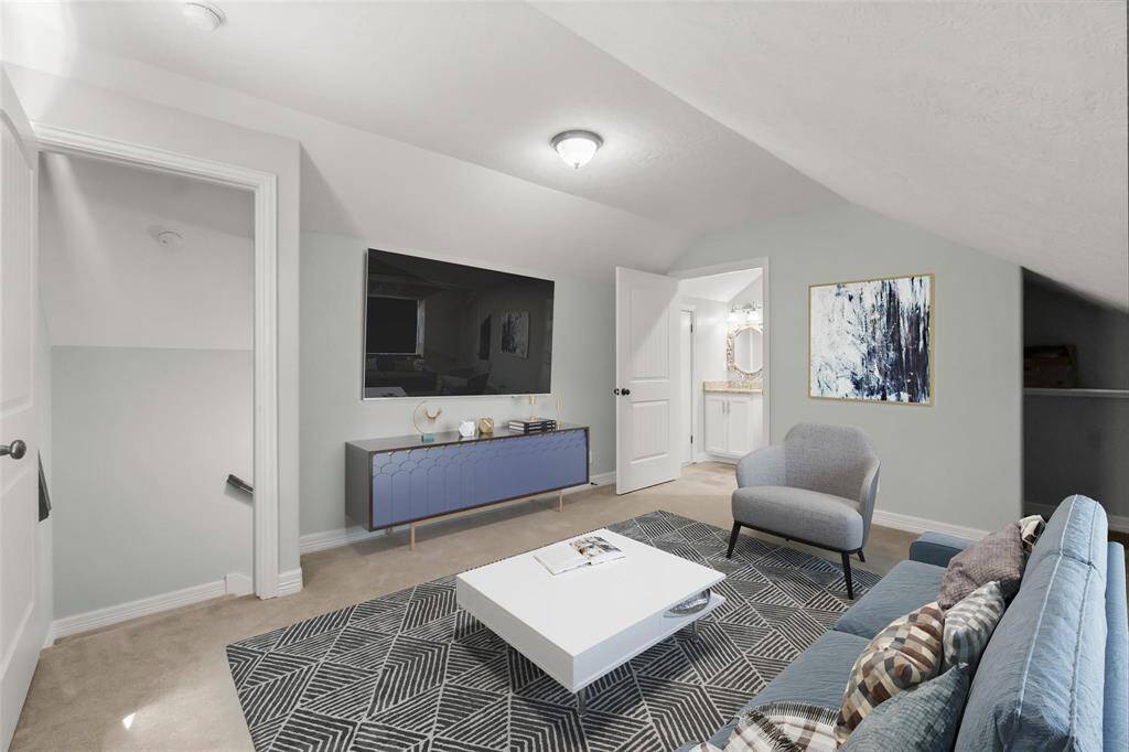 Virtually staged upstairs bonus room.  Paint color is different from representation. Bathroom finishes are similar to what is actually installed.