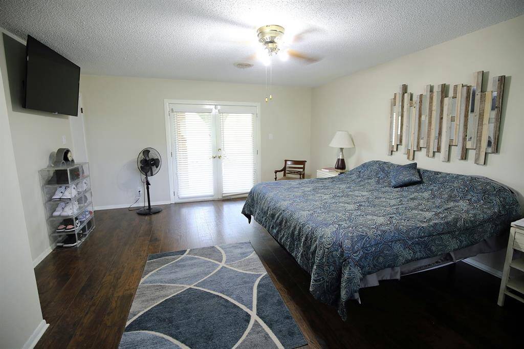 Primary Bedroom with Doors leading to the Backyard!