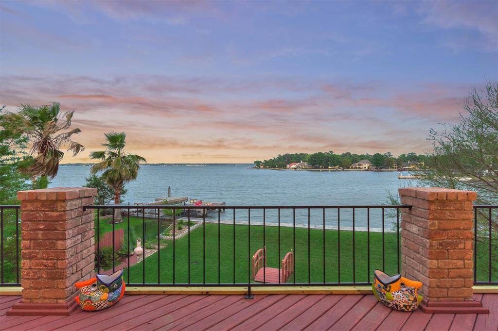 The view from the second-floor balcony is truly breathtaking, offering a stunning vantage point over the lake.