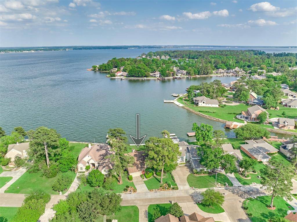 This home is perfectly positioned to maximize open water views of Lake Conroe.