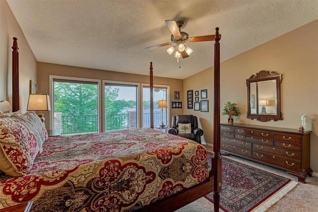 The upstairs location of the primary bedroom maximizes stunning water views.