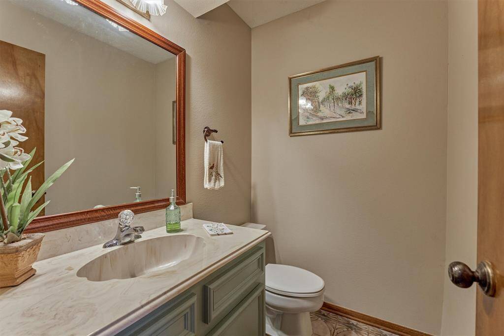 Situated on the main floor with the kitchen and living areas, the half bath provides easy access for guests without disturbing the private spaces of the home.