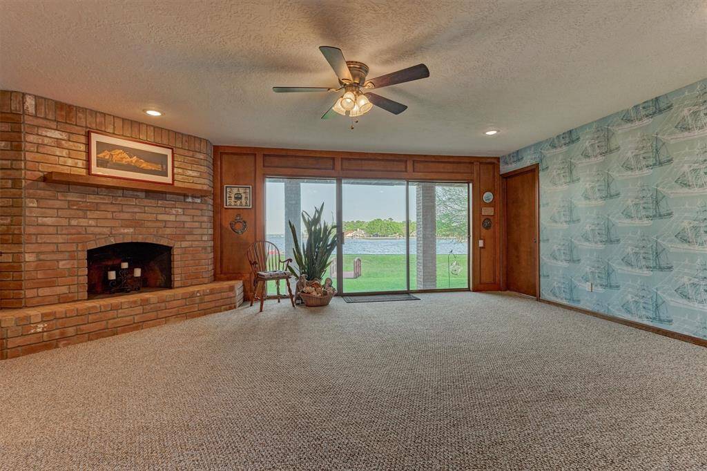 This generously sized first-floor room provides flexible space that can easily serve as a game room, secondary living area, home gym, or office.