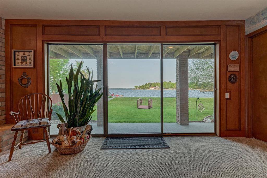 Sliding glass doors from the game room provide easy access to the covered back porch and spacious backyard.