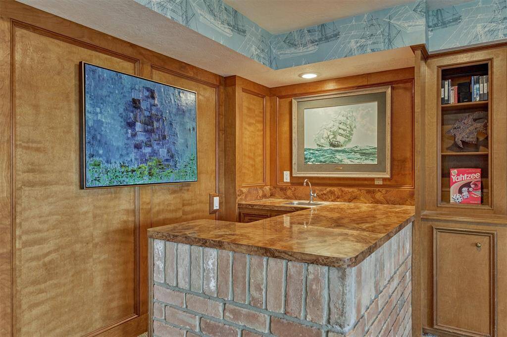 Ideal for hosting, the wet bar adds convenience and style to your entertaining space.