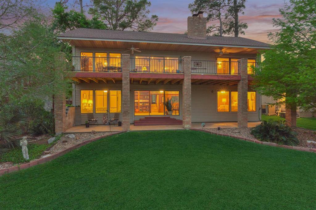 Expansive upper and lower porches run the full length of the home, providing stunning lake views from almost every room.