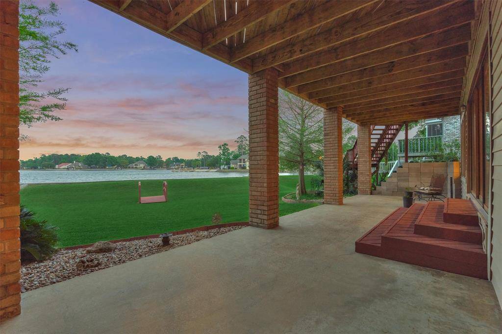 The lower level porch is the perfect place to relax and take in views of the large backyard, which offers endless possibilities for a pool or custom outdoor living space.