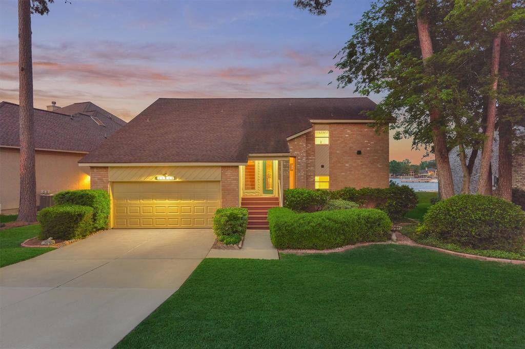 As night falls, the home transforms with elegant lighting that enhances its charm and curb appeal.