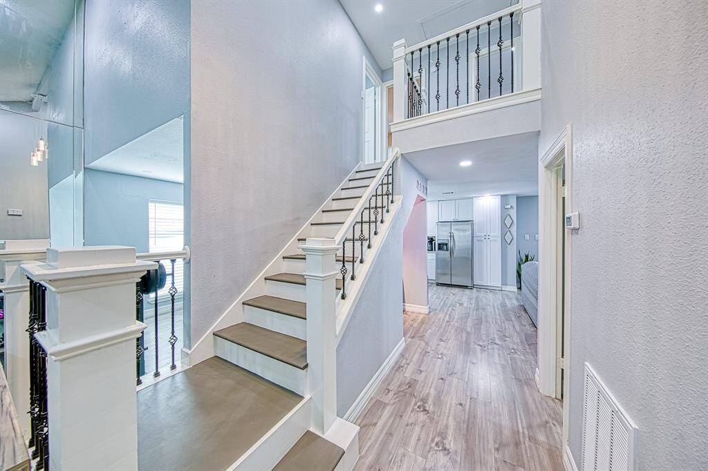 Two story entryway w/mirrored wall