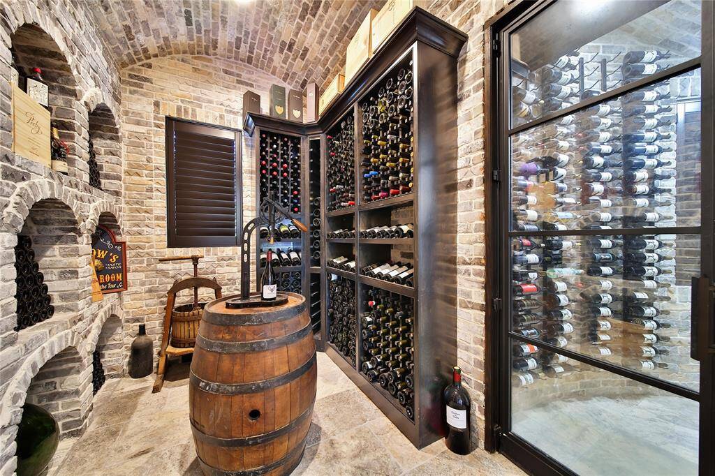 Climate-controlled wine room, perfect for showcasing and preserving your collection.