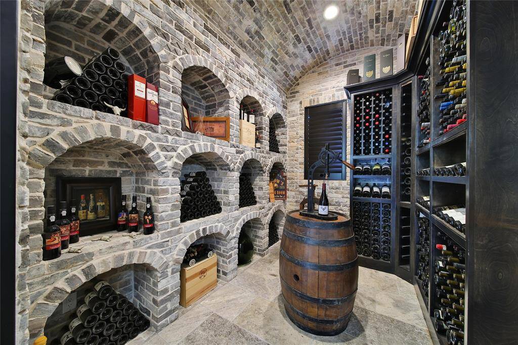 Climate-controlled wine room, perfect for showcasing and preserving your collection.