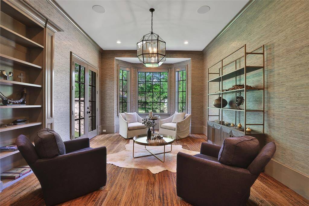 Stunning downstairs office or formal living space with access to the primary suite.