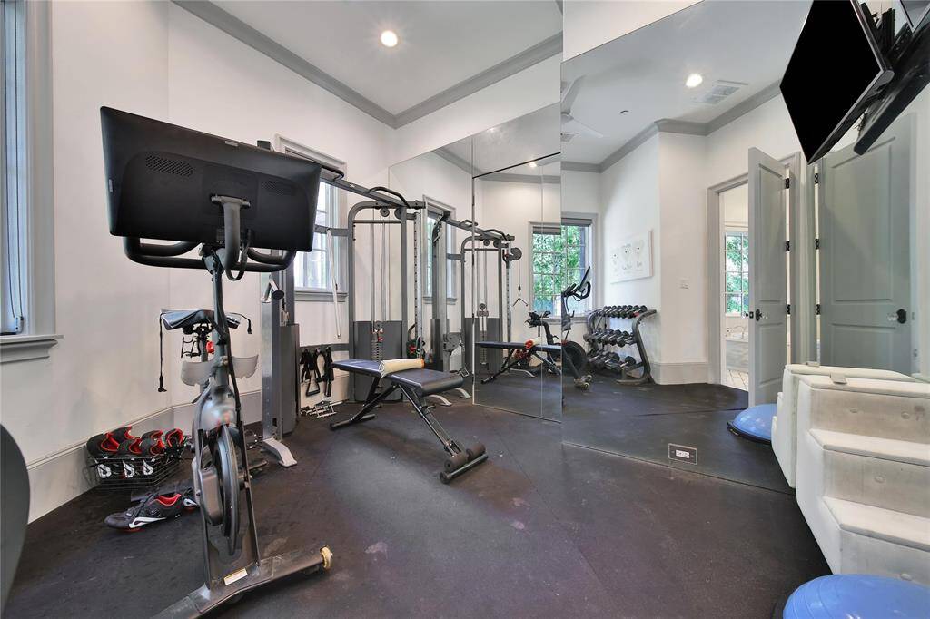 Workout room off the primary bathroom with access to the downstairs home office.