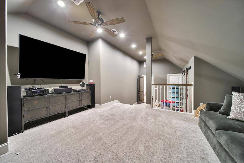 Upstairs media room, perfect for family fun and social gatherings, with room for games, and more.