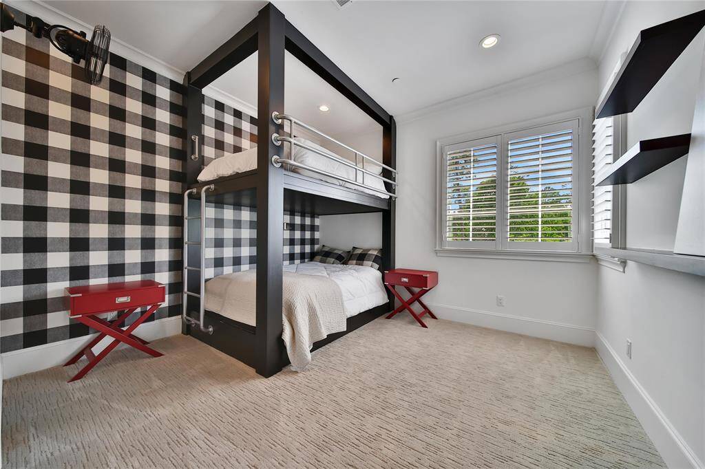Upstairs secondary bedroom featuring custom-built bunk beds, perfect for maximizing space.
