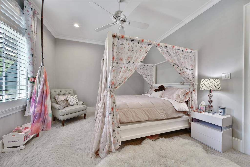 Upstairs secondary bedroom with ensuite bathroom and spacious closet.