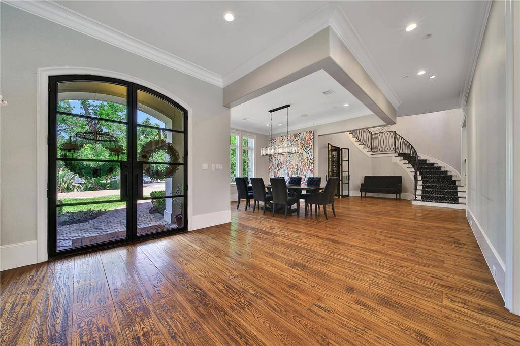 Stunning entryway featuring soaring ceilings and custom finishes.