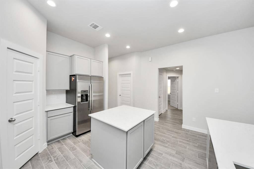 This generously spacious kitchen is a dream realized! Sample photo of completed home with similar floor plan. Actual colors and selections may vary.