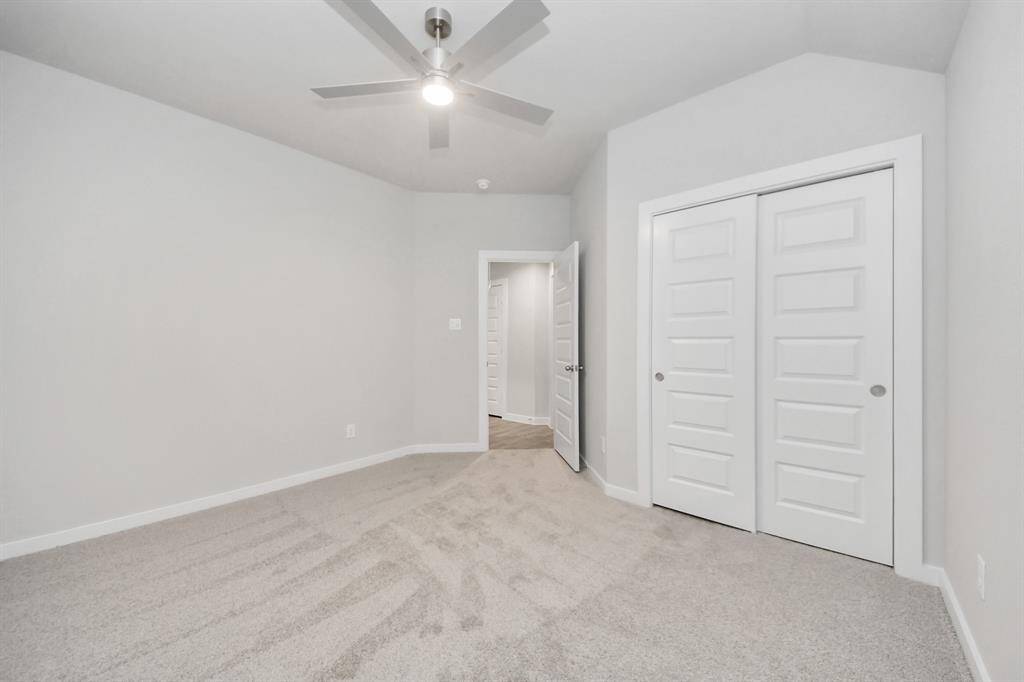 Generously sized secondary bedrooms featuring spacious closets, soft and inviting carpetingunderfoot, large windows allowing plenty of natural light, and the added touch of privacyblinds for your personal retreat. Sample photo of completed home with similar floor plan. Actual colors and selections may vary.