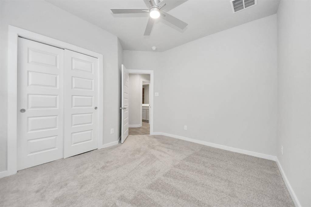 Generously sized secondary bedrooms featuring spacious closets, soft and inviting carpetingunderfoot, large windows allowing plenty of natural light, and the added touch of privacyblinds for your personal retreat. Sample photo of completed home with similar floor plan. Actual colors and selections may vary.