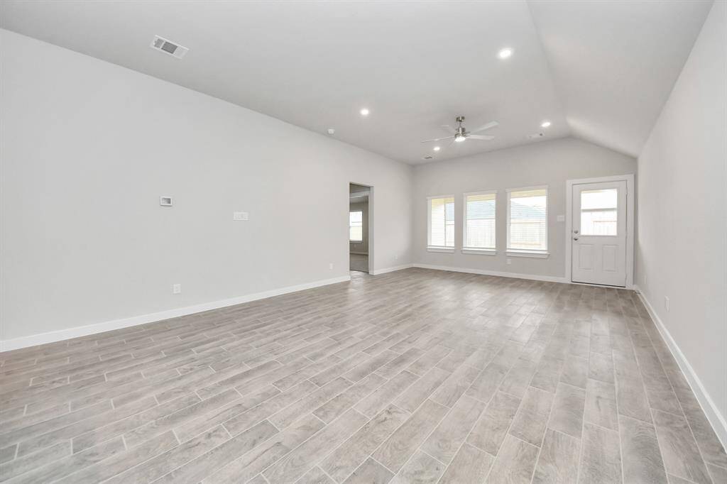 Welcome family and guests to your charming living room! Sample photo of completed home with similar floor plan. Actual colors and selections may vary.