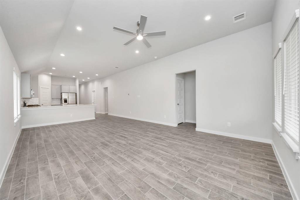 Take another glimpse into the heart of the home with this additional view of thefamily room—a sprawling space ready to accommodate all your gatherings. Sample photo of completed home with similar floor plan. Actual colors and selections may vary.