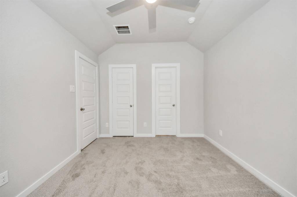Discover another view of the spacious guest suite. Sample photo of completed home with similar floor plan. Actual colors and selections may vary.