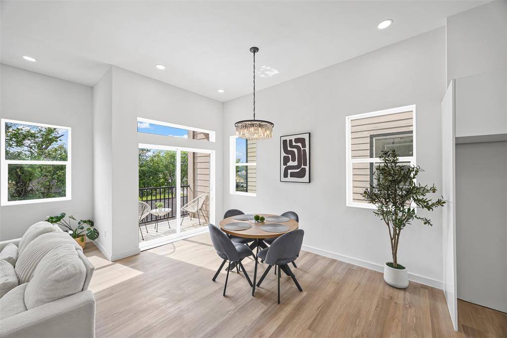 Open dining area with direct access to the private balcony, ideal for indoor/outdoor living and entertaining.