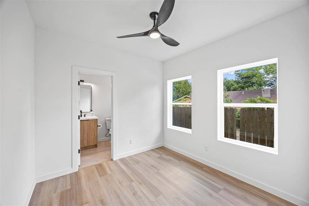 Versatile first floor study or guest suite with full bath, perfect for working from home or hosting visitors.