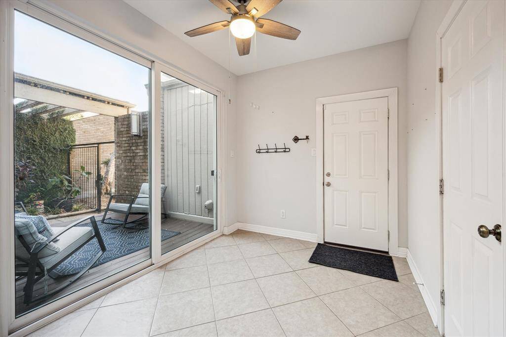 Behind the kitchen is the breakfast area with easy access to the front deck. The garage door is straight ahead and the utility room is on the right.