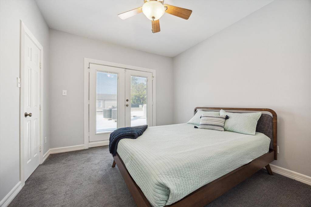 Second guest room with doors that open up to the roof deck.