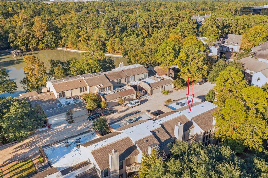 The home is located one row back from the community pond.