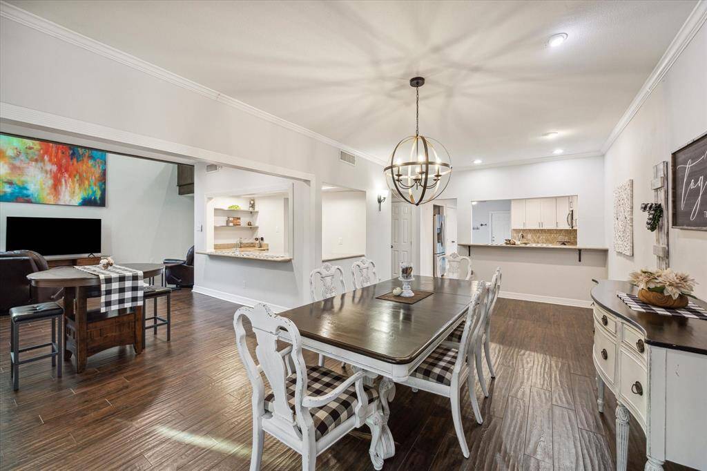 The kitchen is open to the dining room with a pass through and breakfast bar.