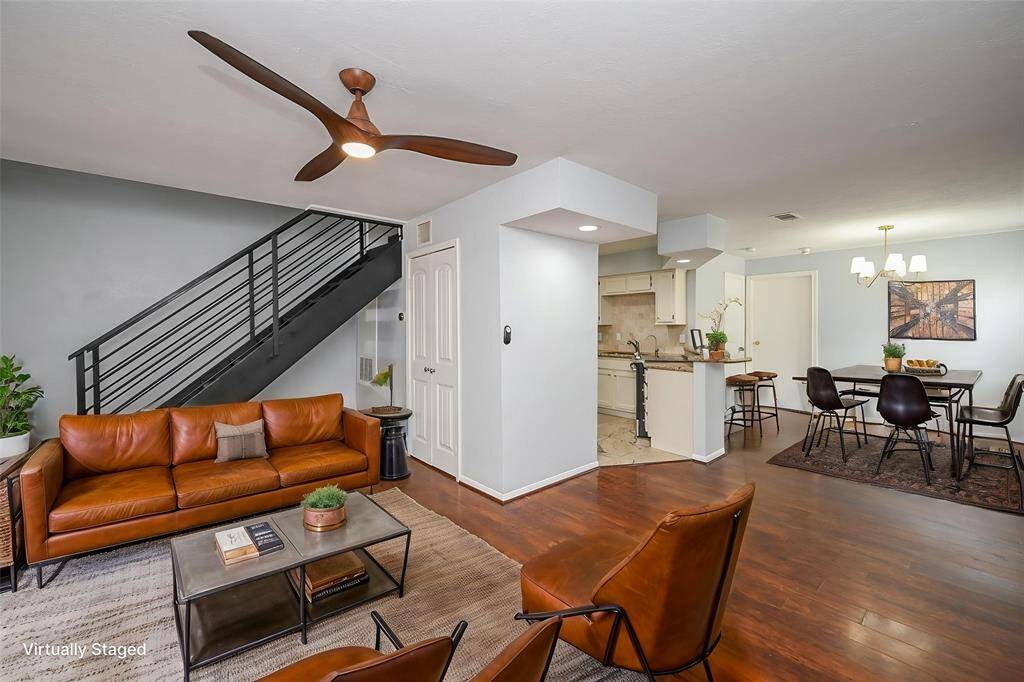 Stylish, open-concept family room with modern design and seamless flow to kitchen and dining areas.