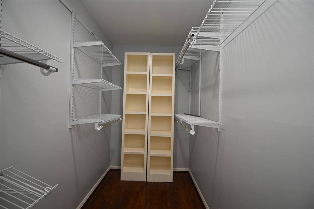 Spacious walk-in closet for all your storage needs.