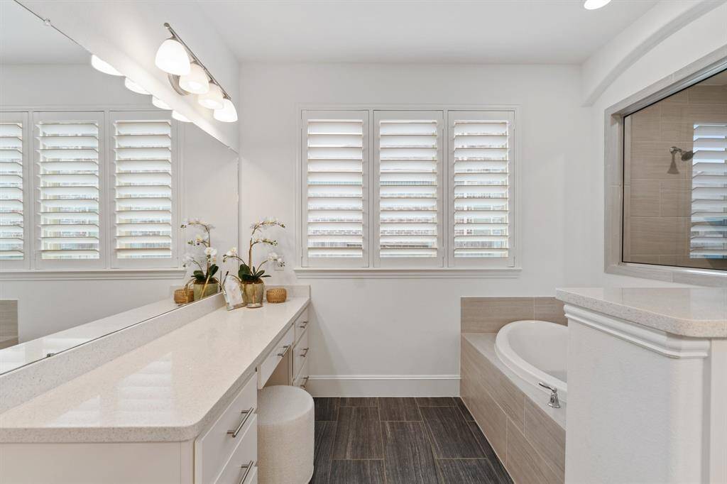 A dedicated vanity area in the primary bathroom adds a touch of luxury and convenience.