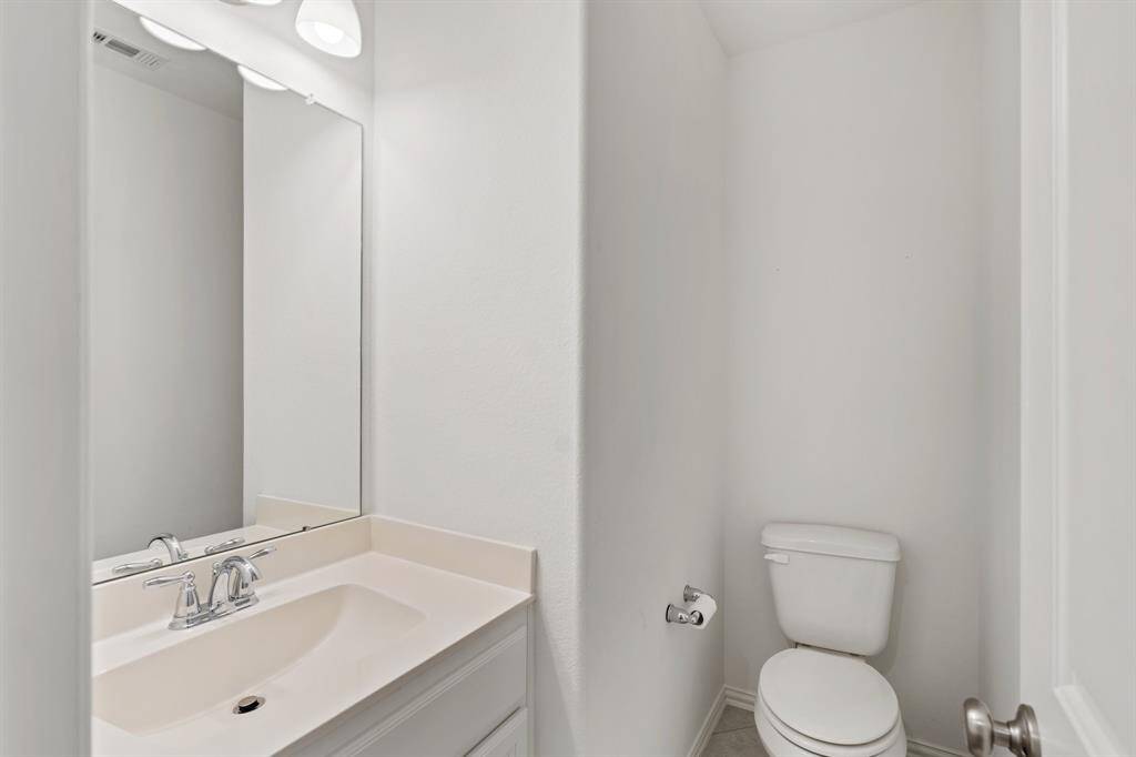 A convenient second half bathroom is located upstairs, ideal for guests or added everyday functionality.