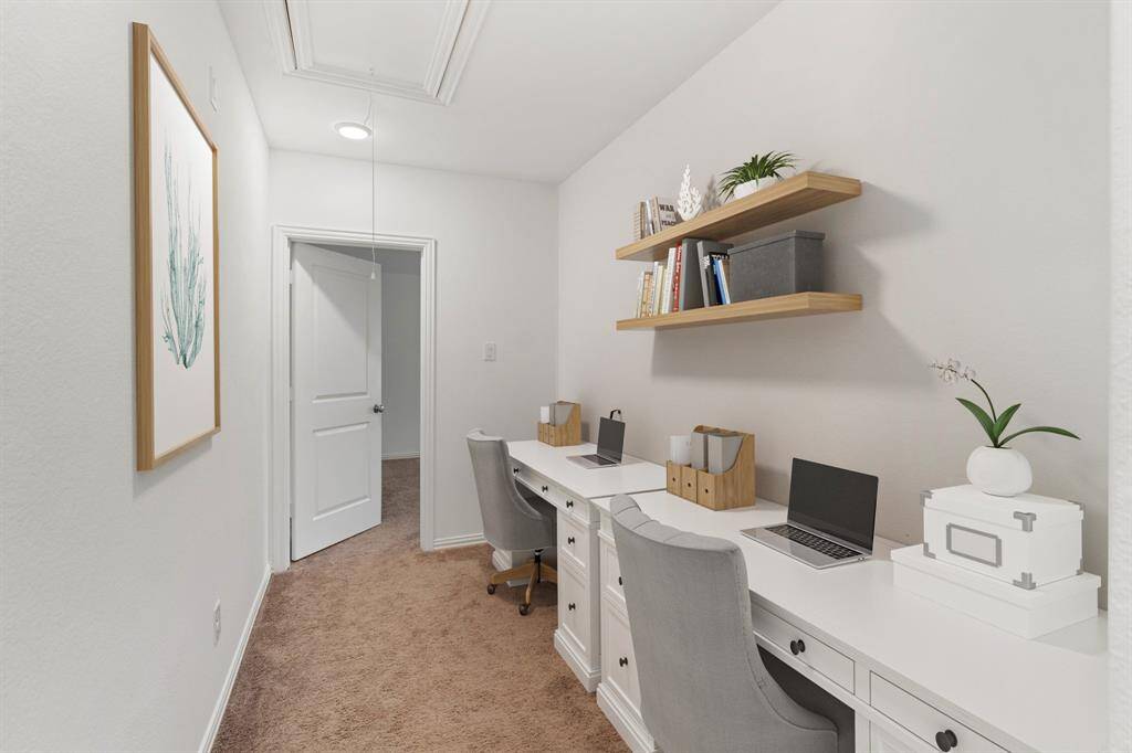 Leading to the third bedroom is a hallway nook providing the perfect space for a dual desk setup—ideal for working from home, studying, or creative projects.