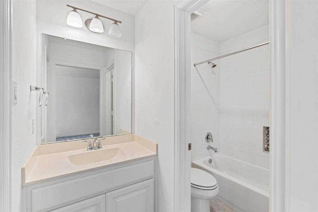 The third bedroom's private full size bathroom.