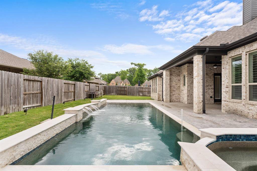 Step outside to a private backyard oasis, featuring a heated pool and spa for year-round enjoyment. A Katchakid pool fence with 2 gates remains with the home.