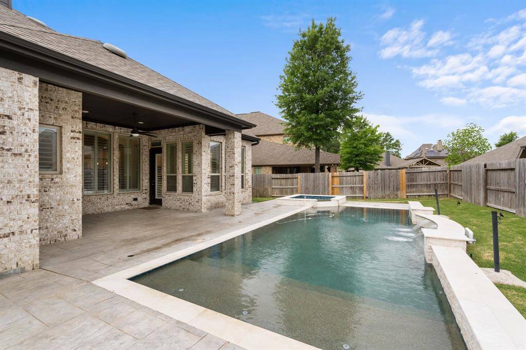 This home is perfect for those who love to blend indoor luxury with outdoor living. The covered patio offers a shaded retreat for outdoor dining and lounging, rain or shine.
