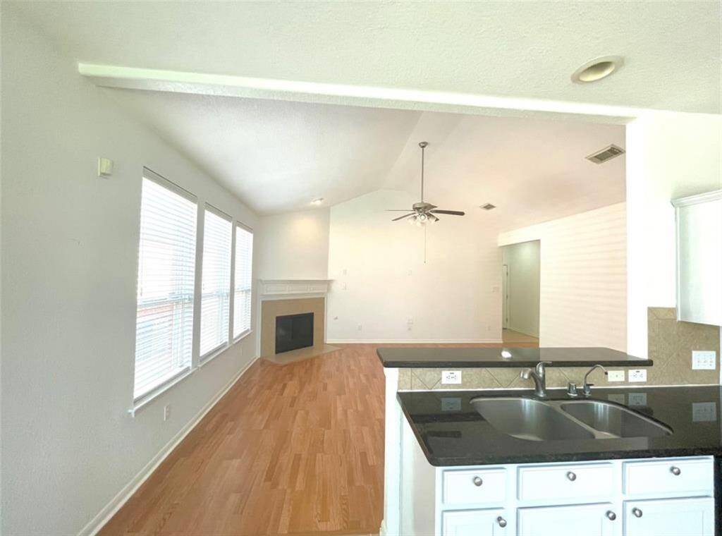 Kitchen opens to living