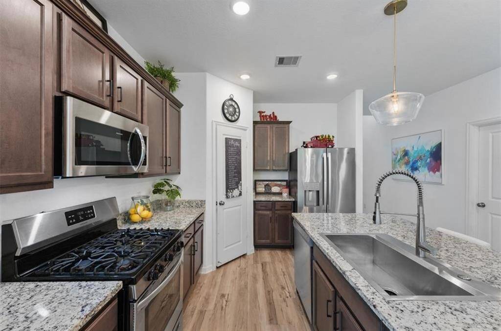 Whether you're meal prepping, hosting friends, or helping with homework, this space does it all in style.
