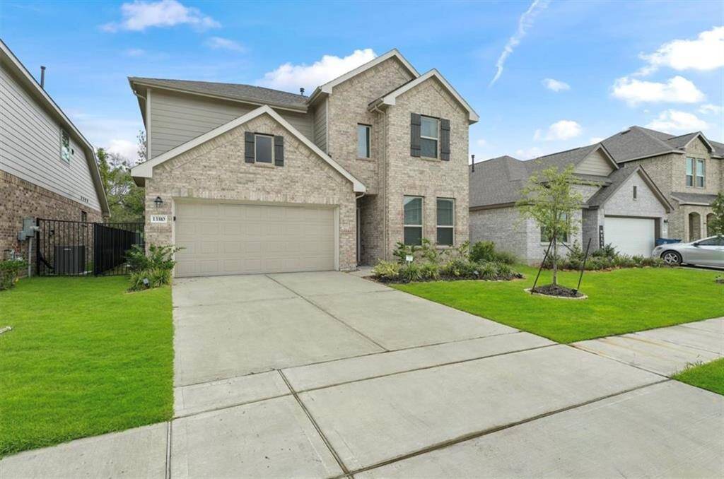 A spacious front yard and inviting entryway set the tone for this stunning home in a quiet, family-friendly neighborhood.