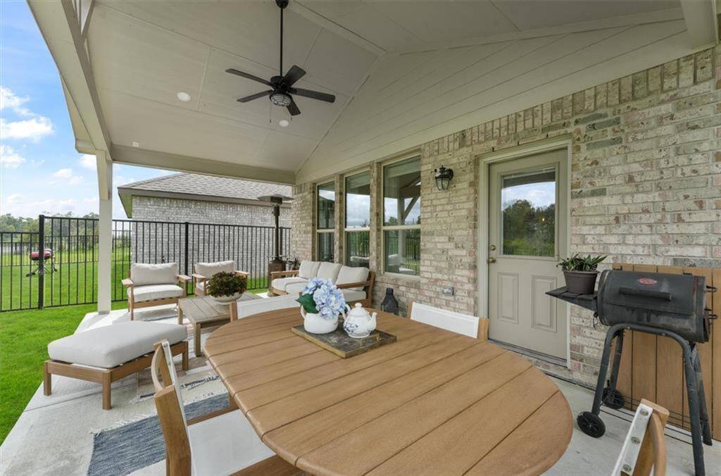 Step outside to a covered patio and spacious backyard—ready for summer BBQs, gardening, or playtime.