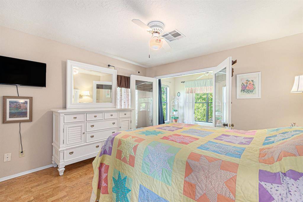 Bedroom 2 with french doors to the balcony