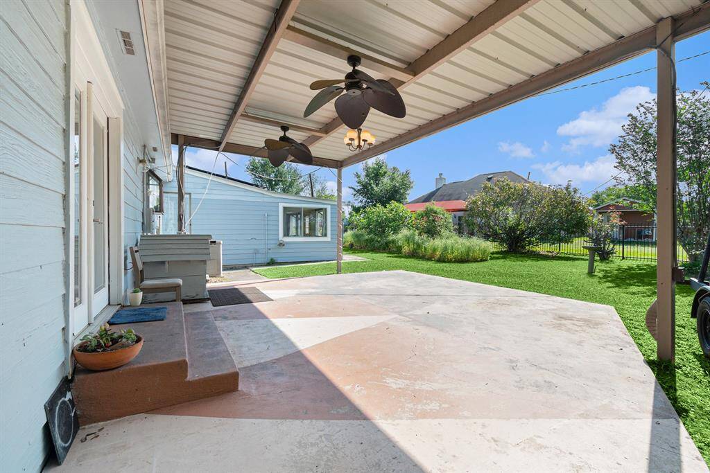 Covered back porch with fans. Perfect for relaxing.